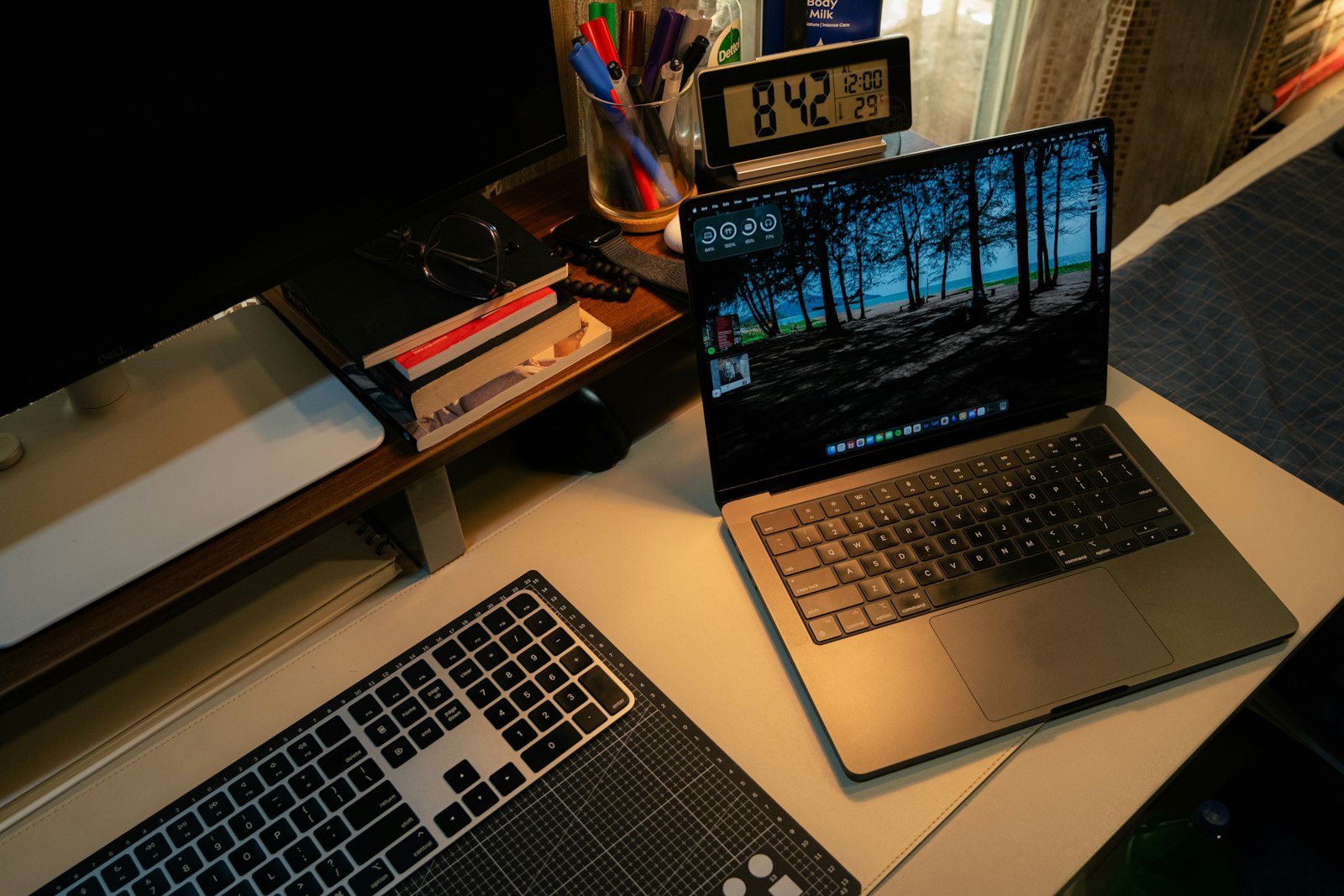 Modern laptop and keyboard in a home office workspace