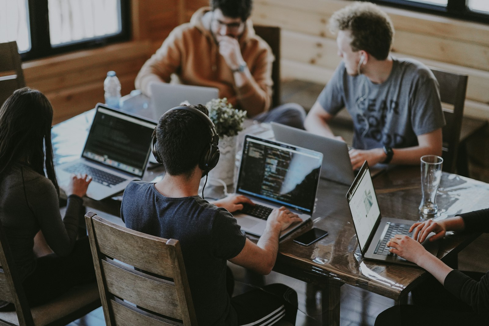 Small team working together with laptops in an office